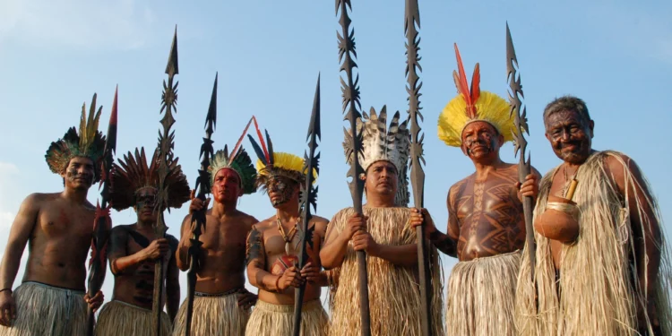 Members of a tribal community engaged in communal farming, reflecting the cooperative nature and social structure of their society